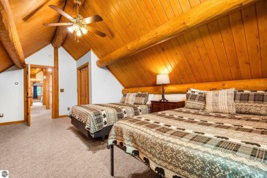 Welcome to this stunning Up North luxury log home perfectly on Boyne Mountain Resort - Monument Course in Michigan - for sale on GolfHomes.com, golf home, golf lot