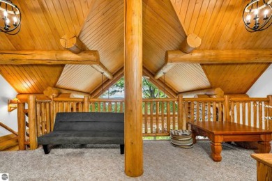 Welcome to this stunning Up North luxury log home perfectly on Boyne Mountain Resort - Monument Course in Michigan - for sale on GolfHomes.com, golf home, golf lot