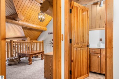 Welcome to this stunning Up North luxury log home perfectly on Boyne Mountain Resort - Monument Course in Michigan - for sale on GolfHomes.com, golf home, golf lot