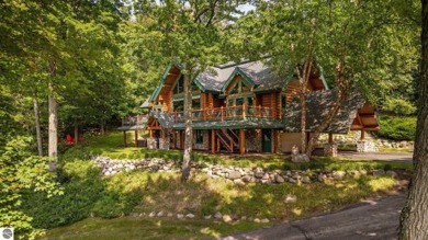 Welcome to this stunning Up North luxury log home perfectly on Boyne Mountain Resort - Monument Course in Michigan - for sale on GolfHomes.com, golf home, golf lot