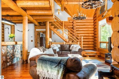 Welcome to this stunning Up North luxury log home perfectly on Boyne Mountain Resort - Monument Course in Michigan - for sale on GolfHomes.com, golf home, golf lot