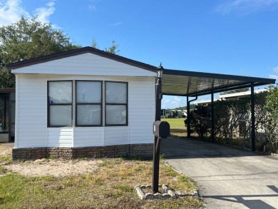 Charming 2-bedroom home in highly sought after Hidden Golf on Lake Henry Golf Club in Florida - for sale on GolfHomes.com, golf home, golf lot