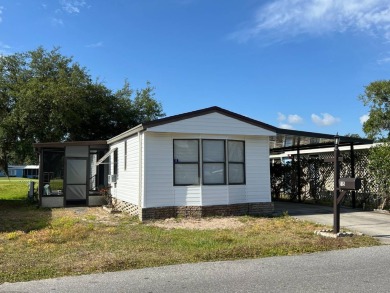 Charming 2-bedroom home in highly sought after Hidden Golf on Lake Henry Golf Club in Florida - for sale on GolfHomes.com, golf home, golf lot