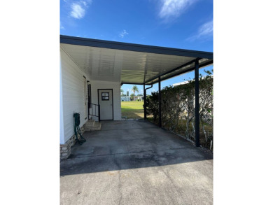 Charming 2-bedroom home in highly sought after Hidden Golf on Lake Henry Golf Club in Florida - for sale on GolfHomes.com, golf home, golf lot
