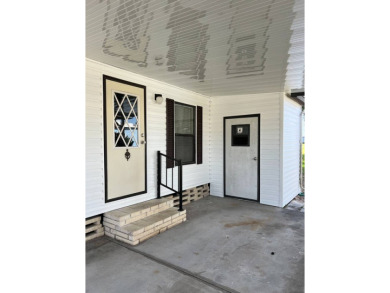 Charming 2-bedroom home in highly sought after Hidden Golf on Lake Henry Golf Club in Florida - for sale on GolfHomes.com, golf home, golf lot