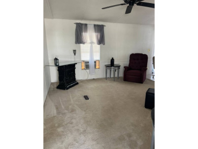 Charming 2-bedroom home in highly sought after Hidden Golf on Lake Henry Golf Club in Florida - for sale on GolfHomes.com, golf home, golf lot