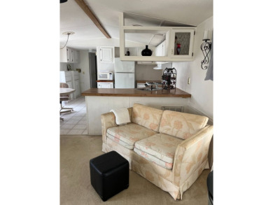 Charming 2-bedroom home in highly sought after Hidden Golf on Lake Henry Golf Club in Florida - for sale on GolfHomes.com, golf home, golf lot
