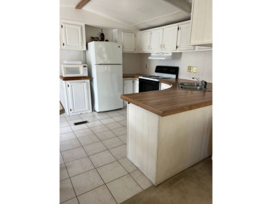 Charming 2-bedroom home in highly sought after Hidden Golf on Lake Henry Golf Club in Florida - for sale on GolfHomes.com, golf home, golf lot