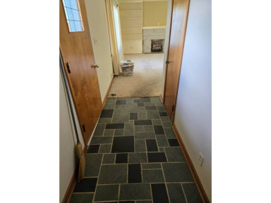 Discover charm and comfort in this 2 bedroom, 1 bath ranch style on Quail Creek Country Club in Illinois - for sale on GolfHomes.com, golf home, golf lot