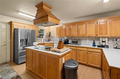 Escape to comfort and serenity at 14 Redruth Lane in beautiful on Bella Vista Country Club - Kingswood in Arkansas - for sale on GolfHomes.com, golf home, golf lot