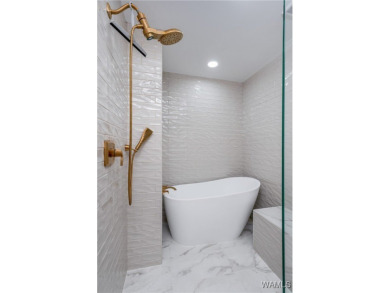 Nestled on a private 2.41-acre lot with an additional 1.51-acre on NorthRiver Yacht Club in Alabama - for sale on GolfHomes.com, golf home, golf lot