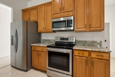 **Move in ready!** This beautifully landscaped all-brick on Magnolia Point Golf and Country Club in Florida - for sale on GolfHomes.com, golf home, golf lot