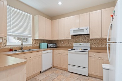 Charming Townhome with Carriage House in Desirable Southwood on Southwood Golf Club in Florida - for sale on GolfHomes.com, golf home, golf lot