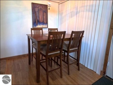 This turn key 2-bedroom, 2-bathroom condo offers beautiful golf on  in Michigan - for sale on GolfHomes.com, golf home, golf lot