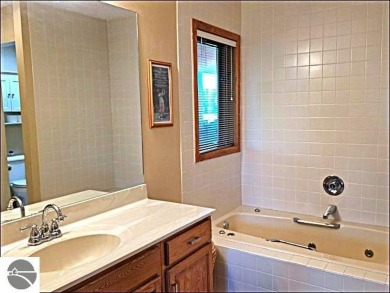 This turn key 2-bedroom, 2-bathroom condo offers beautiful golf on  in Michigan - for sale on GolfHomes.com, golf home, golf lot