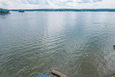 Enjoy the main lake views from spectacular corner condo in on The Golf Club at Cuscowilla in Georgia - for sale on GolfHomes.com, golf home, golf lot