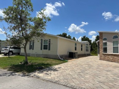 ENJOY PEACEFUL WATERFRONT LIVING IN THIS BRIGHT AND SPACIOUS on Schalamar Creek Golf and Country Club in Florida - for sale on GolfHomes.com, golf home, golf lot