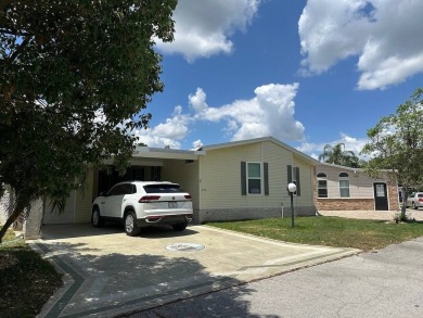 ENJOY PEACEFUL WATERFRONT LIVING IN THIS BRIGHT AND SPACIOUS on Schalamar Creek Golf and Country Club in Florida - for sale on GolfHomes.com, golf home, golf lot