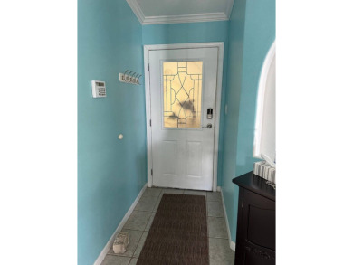 ENJOY PEACEFUL WATERFRONT LIVING IN THIS BRIGHT AND SPACIOUS on Schalamar Creek Golf and Country Club in Florida - for sale on GolfHomes.com, golf home, golf lot