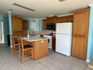 ENJOY PEACEFUL WATERFRONT LIVING IN THIS BRIGHT AND SPACIOUS on Schalamar Creek Golf and Country Club in Florida - for sale on GolfHomes.com, golf home, golf lot