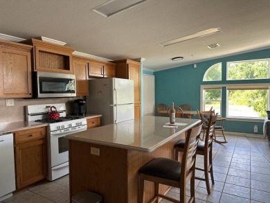 ENJOY PEACEFUL WATERFRONT LIVING IN THIS BRIGHT AND SPACIOUS on Schalamar Creek Golf and Country Club in Florida - for sale on GolfHomes.com, golf home, golf lot