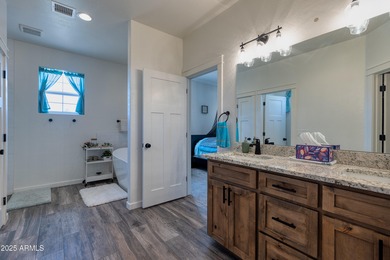 Welcome to this beautifully cared-for 4-bedroom, 2-bathroom home on Snowflake Municipal Golf Course in Arizona - for sale on GolfHomes.com, golf home, golf lot