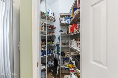This well built, elegant home offers a unique blend of luxury on Sea Trail Golf Resort in North Carolina - for sale on GolfHomes.com, golf home, golf lot