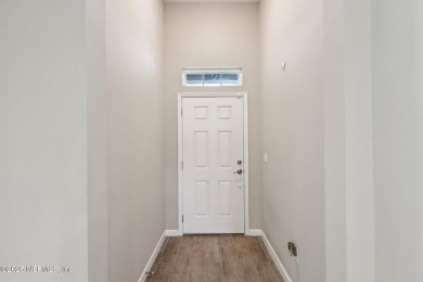Discover modern sophistication in this popular Tivoli model on Eagle Landing Golf Club in Florida - for sale on GolfHomes.com, golf home, golf lot