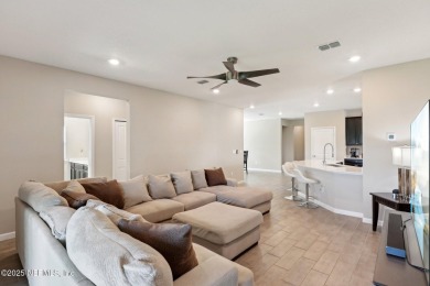Discover modern sophistication in this popular Tivoli model on Eagle Landing Golf Club in Florida - for sale on GolfHomes.com, golf home, golf lot