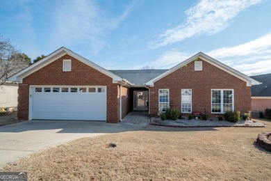 Enjoy low-maintenance living in a beautiful golf course setting on Jennings Mill Country Club in Georgia - for sale on GolfHomes.com, golf home, golf lot