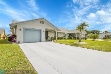 IMMACULATE 2 bed 2 bath VILLA features light-filled, OPEN floor on Cypress Lakes Golf Course - West Palm Beach in Florida - for sale on GolfHomes.com, golf home, golf lot