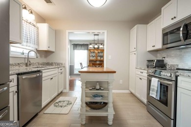 Enjoy low-maintenance living in a beautiful golf course setting on Jennings Mill Country Club in Georgia - for sale on GolfHomes.com, golf home, golf lot