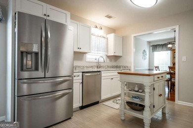 Enjoy low-maintenance living in a beautiful golf course setting on Jennings Mill Country Club in Georgia - for sale on GolfHomes.com, golf home, golf lot