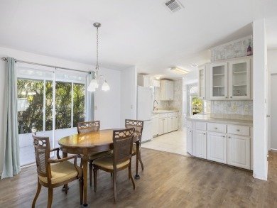 This 2004 2-bed, 2-bath split-plan home is nestled on a quiet on Barefoot Bay Golf Course in Florida - for sale on GolfHomes.com, golf home, golf lot