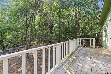 Nestled in the prestigious Holly Lake Ranch subdivision and on Holly Lake Ranch Golf Club in Texas - for sale on GolfHomes.com, golf home, golf lot