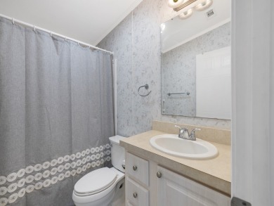 This 2004 2-bed, 2-bath split-plan home is nestled on a quiet on Barefoot Bay Golf Course in Florida - for sale on GolfHomes.com, golf home, golf lot