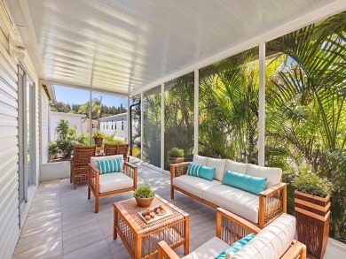 This 2004 2-bed, 2-bath split-plan home is nestled on a quiet on Barefoot Bay Golf Course in Florida - for sale on GolfHomes.com, golf home, golf lot