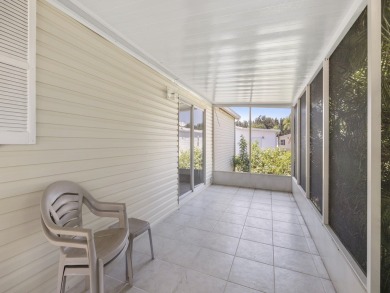 This 2004 2-bed, 2-bath split-plan home is nestled on a quiet on Barefoot Bay Golf Course in Florida - for sale on GolfHomes.com, golf home, golf lot