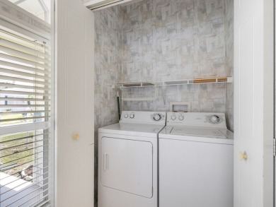 This 2004 2-bed, 2-bath split-plan home is nestled on a quiet on Barefoot Bay Golf Course in Florida - for sale on GolfHomes.com, golf home, golf lot