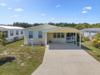 This 2004 2-bed, 2-bath split-plan home is nestled on a quiet on Barefoot Bay Golf Course in Florida - for sale on GolfHomes.com, golf home, golf lot