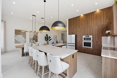 Located on the 11th hole in Aberdeen Golf & Country Club, this on Aberdeen Golf and Country Club in Florida - for sale on GolfHomes.com, golf home, golf lot