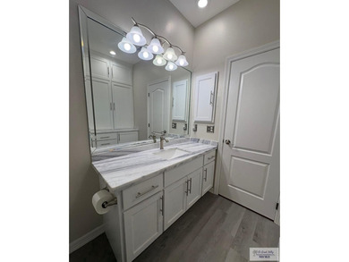 Situated in a gated community with beautiful Resaca views, this on South Padre Island Golf Club in Texas - for sale on GolfHomes.com, golf home, golf lot