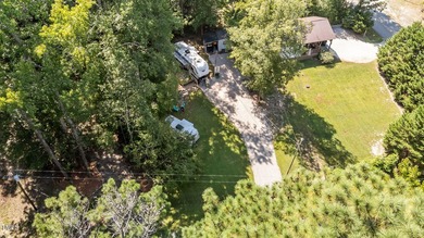 Golf Cart will convey with acceptable offer!! Discover a on River Golf and Country Club at Lake Royale in North Carolina - for sale on GolfHomes.com, golf home, golf lot