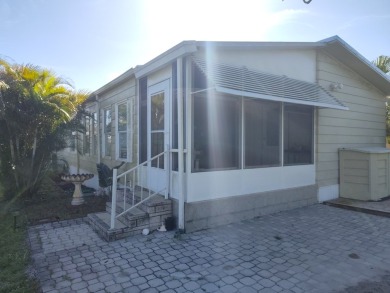 This 1988 offset double-wide home can fulfill your dreams of on Spanish Lakes Country Club in Florida - for sale on GolfHomes.com, golf home, golf lot