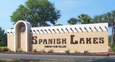 This 1988 offset double-wide home can fulfill your dreams of on Spanish Lakes Country Club in Florida - for sale on GolfHomes.com, golf home, golf lot