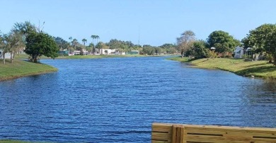 This 1988 offset double-wide home can fulfill your dreams of on Spanish Lakes Country Club in Florida - for sale on GolfHomes.com, golf home, golf lot