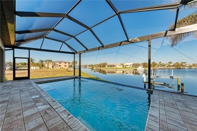 Fall in love with this 2015 built custom waterfront pool home on Saint Andrews South Golf Club in Florida - for sale on GolfHomes.com, golf home, golf lot