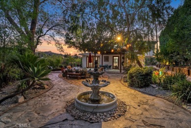 Passing through the hand-crafted wrought iron security gates and on Woodland Hills Country Club in California - for sale on GolfHomes.com, golf home, golf lot