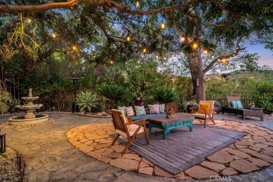 Passing through the hand-crafted wrought iron security gates and on Woodland Hills Country Club in California - for sale on GolfHomes.com, golf home, golf lot