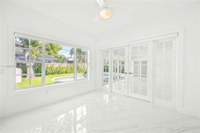 Welcome to 345 Fairway Drive - where vintage charm and modern on Normandy Shores Golf Course in Florida - for sale on GolfHomes.com, golf home, golf lot